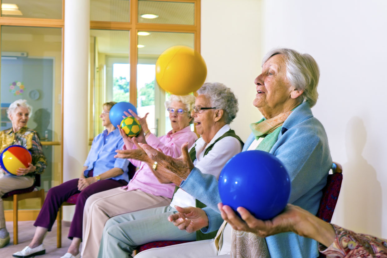 Seated Parkinson's Lancashire exercise with ball